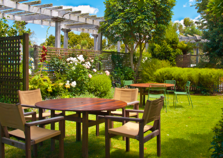 dining-table-set-in-lush-landscaped-garden-2023-11-27-05-14-03-utc 1