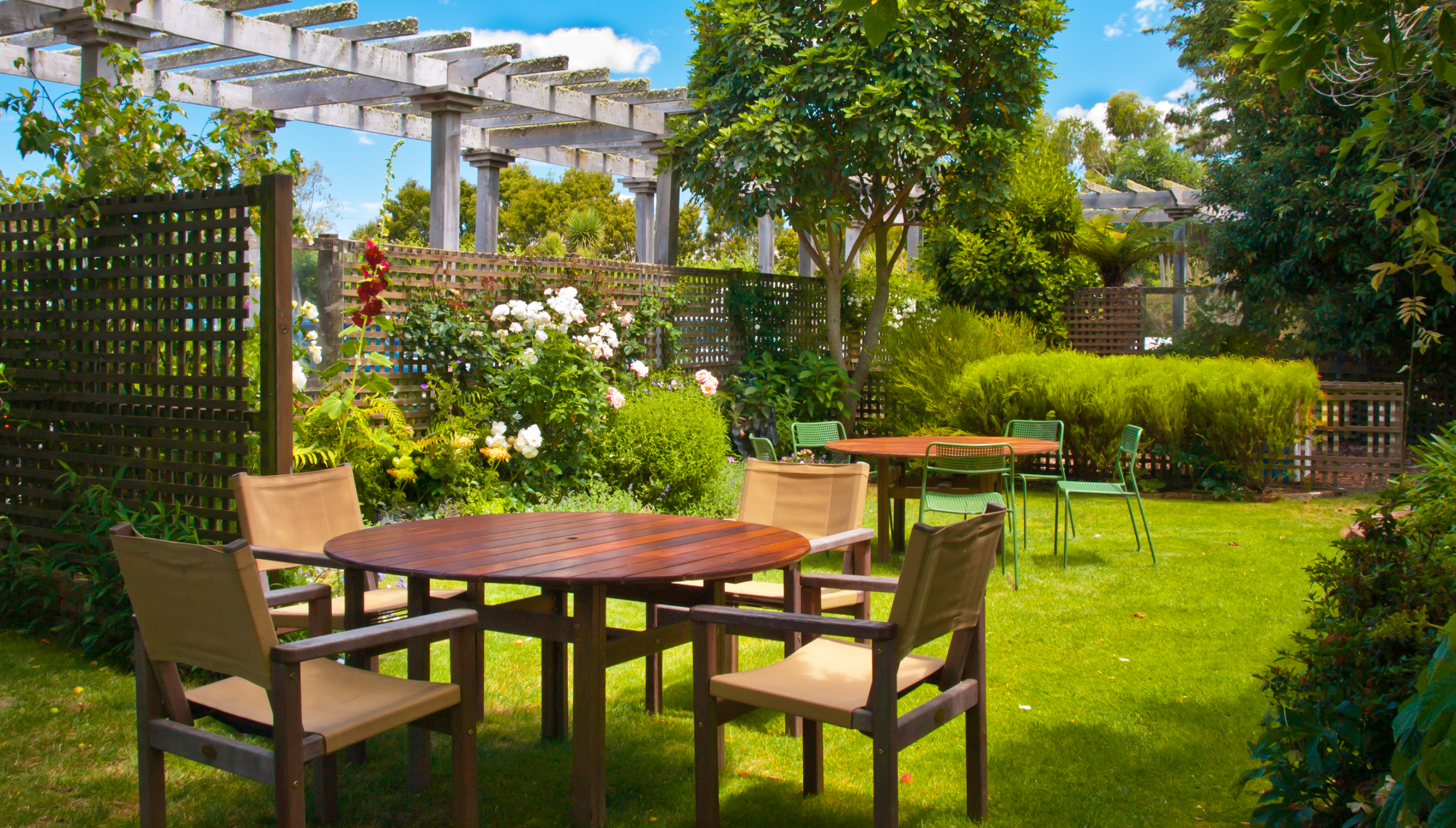 dining-table-set-in-lush-landscaped-garden-2023-11-27-05-14-03-utc 1